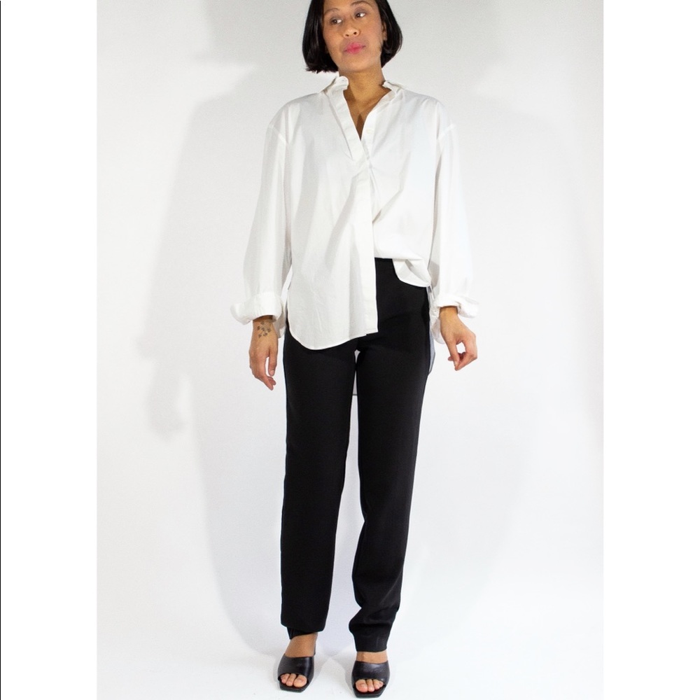 Chanel “Uniform” black mid-rise stretchy slacks.